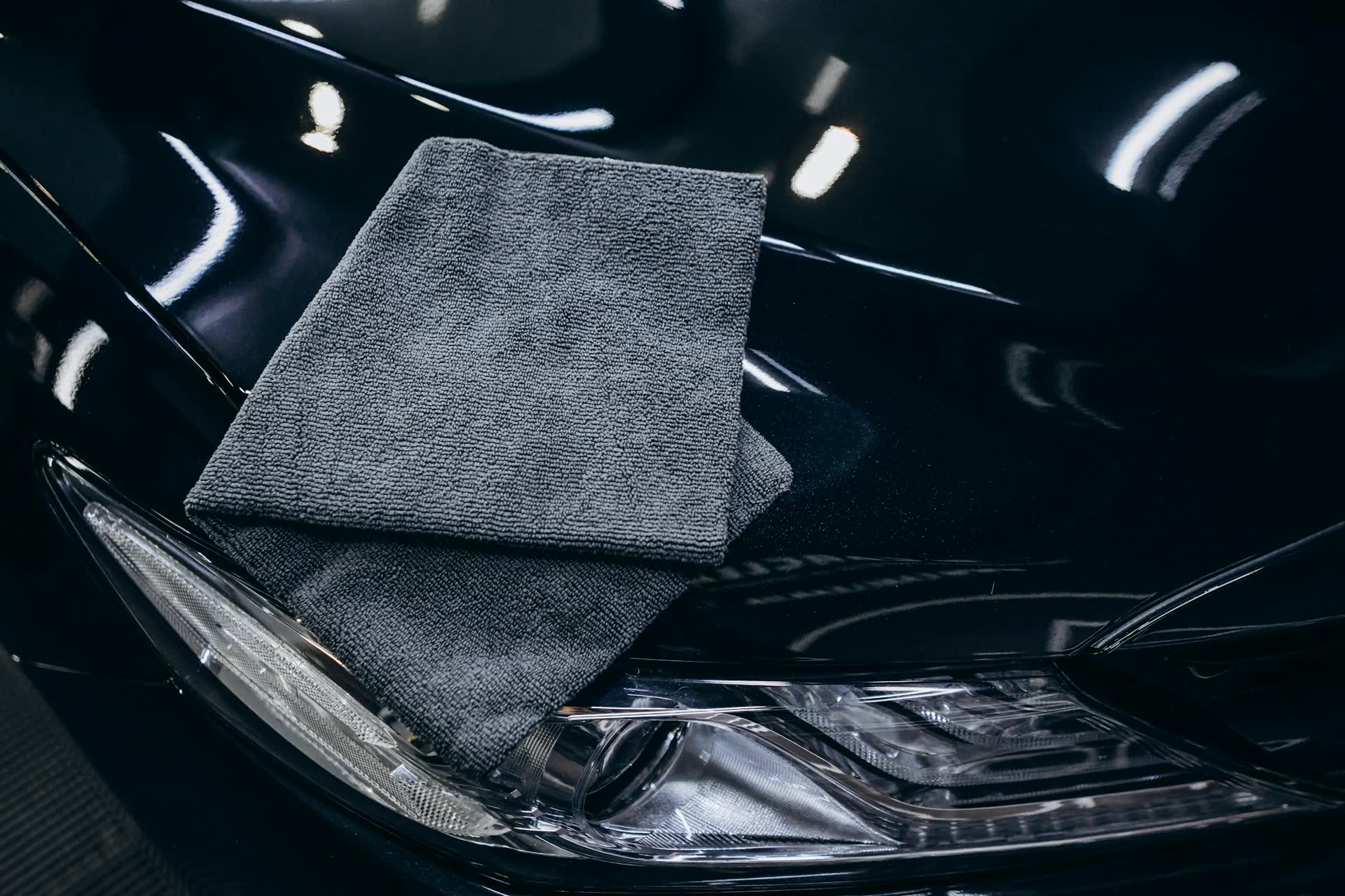 Microfiber towel on a finished black hood