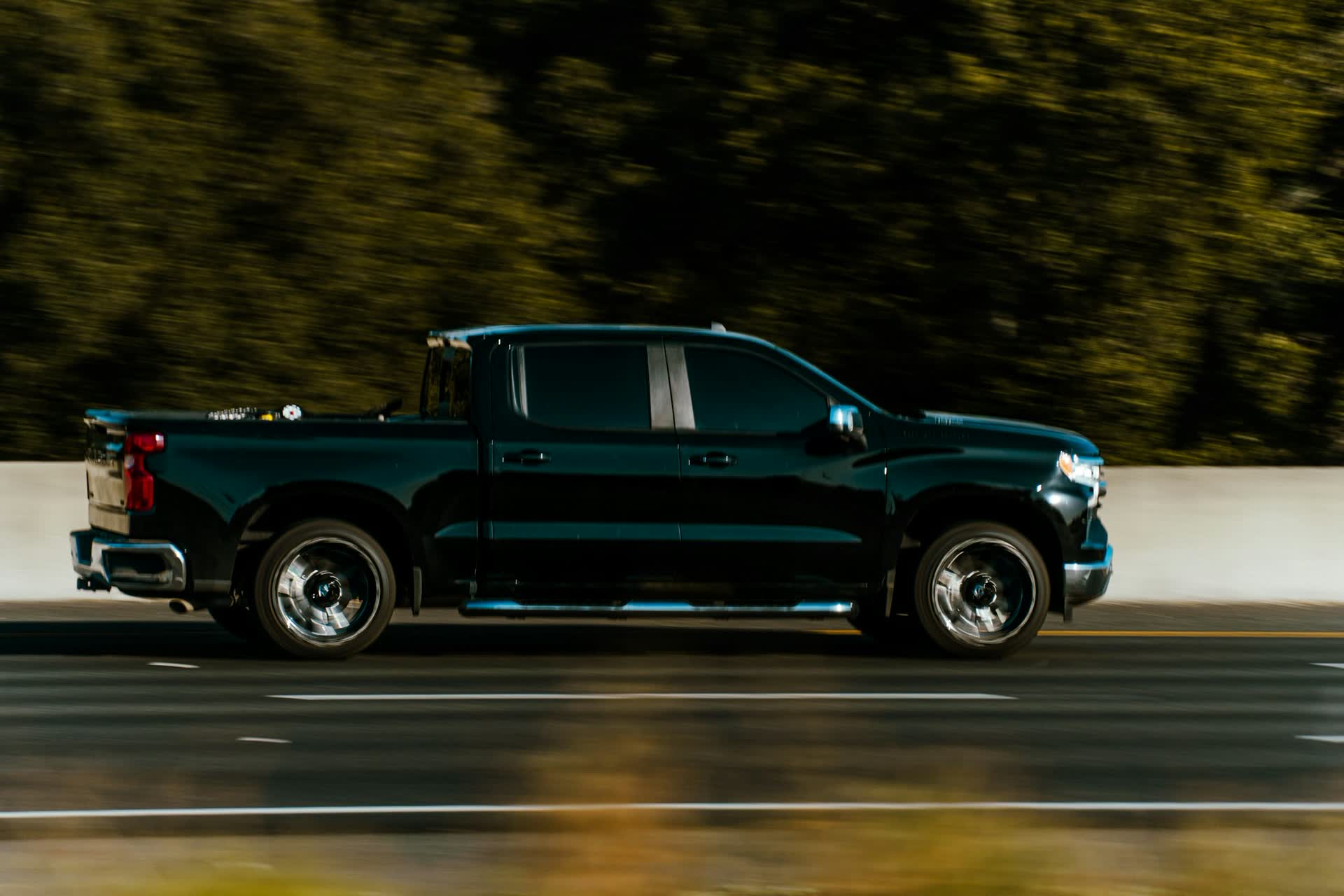 Dark green pickup truck with a deep gloss finish